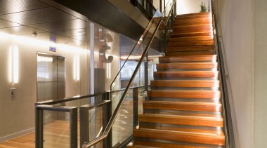 Timber flooring throughout the bank features grey ironbark architecture, daylighting, glass, handrail, interior design, stairs, wood, brown