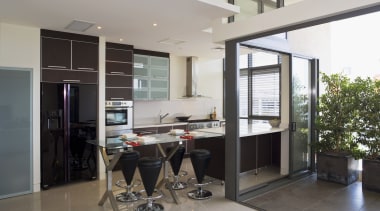 View of a custom-designed kitchen which features a house, interior design, real estate, window, gray, black