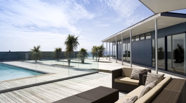 Image of the exterior of this beautifully designed apartment, architecture, condominium, estate, house, leisure, leisure centre, penthouse apartment, property, real estate, resort, swimming pool, white