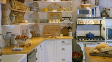 View of a remodelled country-styled kitchen which features cabinetry, countertop, cuisine classique, interior design, kitchen, room, brown, gray