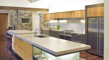 View of a kitchen which features ovens, refrigerator, cabinetry, countertop, cuisine classique, daylighting, floor, flooring, hardwood, interior design, kitchen, laminate flooring, real estate, wood, wood flooring, white