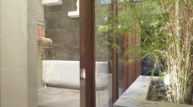 View of renovated bathroom, featuring bathtub, ceramic tiled architecture, door, glass, home, house, interior design, property, real estate, window, gray, brown