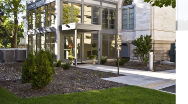 Exterior view of the Phillips Family Offices featuring architecture, courtyard, elevation, estate, facade, grass, home, house, landscaping, lawn, mansion, mixed use, neighbourhood, property, real estate, residential area, yard, brown, white