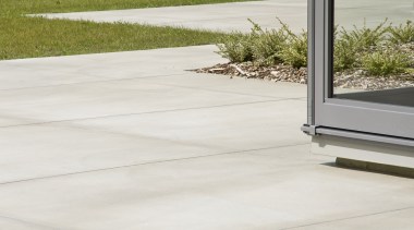 Image of coloured concrete from Peter Fell Ltd asphalt, driveway, floor, grass, lawn, outdoor structure, path, road surface, walkway, wood, white, brown