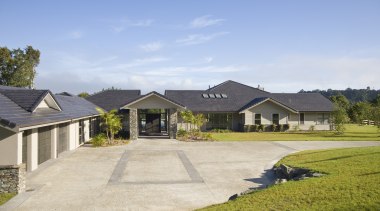 Image of this new home which features Artisan cottage, estate, farmhouse, grass, home, house, land lot, landscape, property, real estate, residential area, roof, sky, suburb, teal, gray