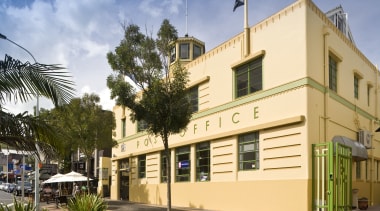 Exterior view of a restored post office building apartment, building, condominium, facade, home, house, mixed use, neighbourhood, property, real estate, residential area, orange, brown