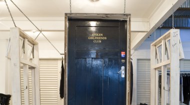 View of the old construction door which is glass, white
