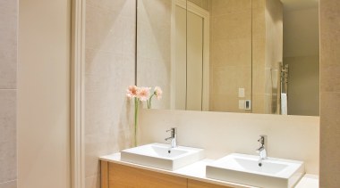 View of a bathroom designed by Natalie Du bathroom, bathroom accessory, bathroom cabinet, interior design, room, sink, orange