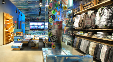 View of the clothing displays including curved panels retail, black