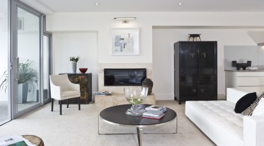 View of apartment living room with carpeted flooring, floor, flooring, home, interior design, living room, property, real estate, room, gray, white