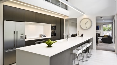 View of kitchen featuring large island, dark-stained oak countertop, interior design, kitchen, real estate, white