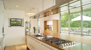 View of a kitchen which features a large countertop, estate, home, house, interior design, kitchen, property, real estate, window, orange