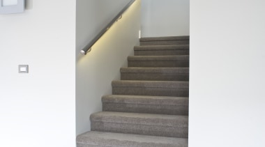View of a carpeted stairway at the Harbourcity architecture, daylighting, floor, flooring, handrail, home, house, interior design, laminate flooring, product design, stairs, wood flooring, white, gray
