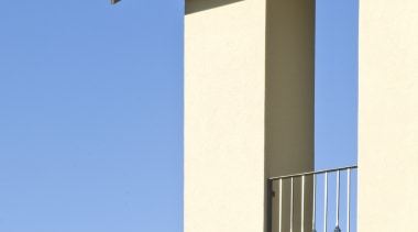 Exterior view of a high-end home with a architecture, building, column, facade, house, sky, structure, window, teal