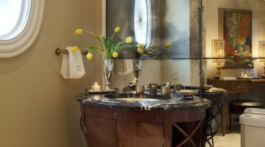 View of a powder room which features a bathroom, ceiling, furniture, home, interior design, room, table, brown