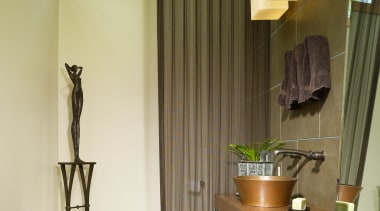 View of a small powder room which features architecture, ceiling, curtain, floor, flooring, furniture, hardwood, home, house, interior design, living room, real estate, room, table, wall, window, window covering, window treatment, wood, brown, yellow