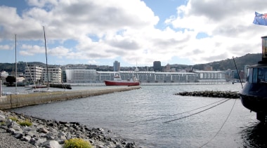 Exterior view of the Wellington Overseas Passenger Terminal boat, cloud, dock, marina, port, river, sky, water, water transportation, waterway, gray, white