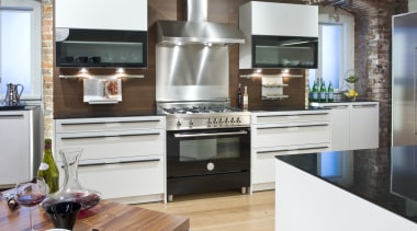 View of a contemporary kitchen which features a cabinetry, countertop, cuisine classique, home appliance, interior design, kitchen, kitchen appliance, kitchen stove, small appliance, white