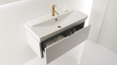 View of a Kohler basin with gold faucets bathroom, bathroom accessory, bathroom cabinet, bathroom sink, ceramic, drawer, plumbing fixture, product design, sink, tap, white