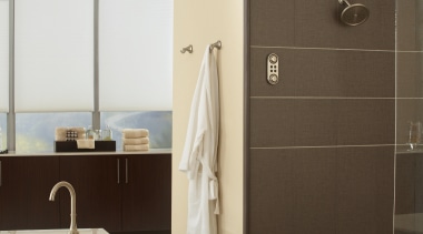 View of a bathroom which features a bathtub bathroom, bathroom accessory, bathroom cabinet, floor, interior design, plumbing fixture, product design, room, tap, black