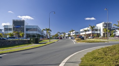 external view of inteplex@albany developed by northbridge properties. area, asphalt, car, city, daytime, downtown, house, infrastructure, lane, metropolitan area, neighbourhood, real estate, residential area, road, sky, street light, suburb, town, tree, urban area, teal