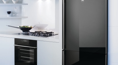 View of a kitchen which features a refrigerator, home appliance, interior design, kitchen, kitchen appliance, kitchen stove, major appliance, product, product design, refrigerator, white, black