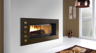 View of a living area which features a fireplace, hearth, heat, home appliance, wood burning stove, gray