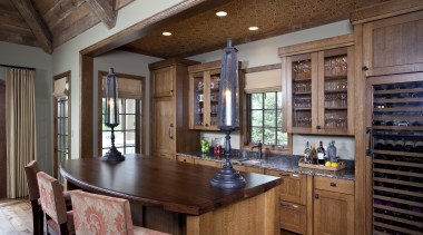 Exposed wood beams with metal strapping enhance the cabinetry, countertop, cuisine classique, estate, hardwood, interior design, kitchen, real estate, room, wood, brown