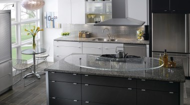 View of a contemporary kitchen which features countertops cabinetry, countertop, cuisine classique, interior design, kitchen, kitchen stove, sink, black, white