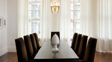 View of dining room featuring a table by ceiling, chair, curtain, dining room, floor, flooring, furniture, home, interior design, living room, room, table, window, window covering, window treatment, gray