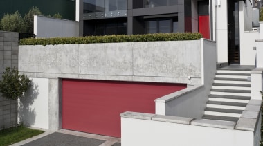 View of the exterior featuring concrete, aluminum cladding architecture, building, elevation, facade, home, house, neighbourhood, property, real estate, residential area, suburb, white