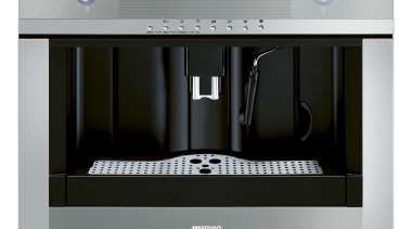 Designed by Hacker Kitchens, this kitchen features appliances coffeemaker, espresso machine, home appliance, kitchen appliance, product, product design, small appliance, gray, black