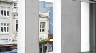view of the glass fibre-reinforced concrete cladding manufactured door, facade, window, white, gray