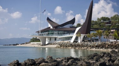 With its distinctive sail and keel forms, the coast, coastal and oceanic landforms, sea, sky, tourism, water, teal, gray