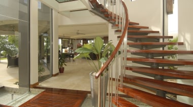 Interior view of a self sustainable house designed apartment, balcony, daylighting, estate, floor, flooring, handrail, hardwood, home, house, interior design, property, real estate, stairs, wood, brown, orange