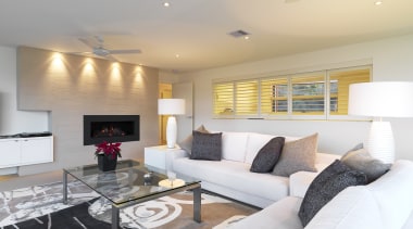 View of lounge which features L-shaped white sofa, ceiling, floor, home, interior design, living room, property, real estate, room, gray