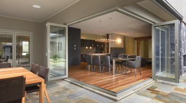 Exterior view of the outdoor living area which estate, floor, flooring, house, interior design, living room, property, real estate, window, gray, brown