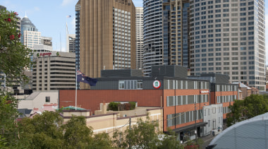 Exterior view of the Sydney Harbour YHA which apartment, architecture, building, city, cityscape, commercial building, condominium, corporate headquarters, daytime, downtown, home, metropolis, metropolitan area, mixed use, neighbourhood, plaza, real estate, residential area, skyline, skyscraper, suburb, tower block, tree, urban area, gray, brown