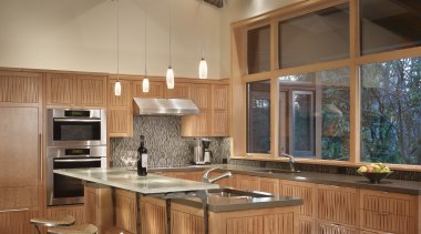 Interior view of the kitchen which has wood beam, cabinetry, ceiling, countertop, cuisine classique, hardwood, interior design, kitchen, real estate, wood, wood flooring, brown, orange