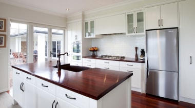 View of a kitchen which features wooden benchtops cabinetry, countertop, cuisine classique, interior design, kitchen, real estate, room, gray, white