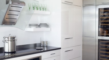 View of contemporary apartment kitchen which features timber cabinetry, countertop, cuisine classique, floor, home appliance, interior design, kitchen, kitchen appliance, kitchen stove, major appliance, refrigerator, room, gray, white