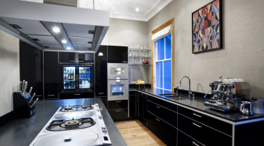 View of a contemporary kitchen which features a countertop, interior design, kitchen, gray, black