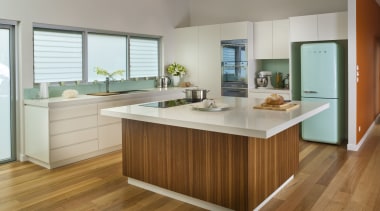 View of contemporary kitchen with light toned benchtops cabinetry, countertop, cuisine classique, floor, flooring, hardwood, interior design, kitchen, laminate flooring, room, wood, wood flooring, gray, brown