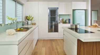 View of contemporary light toned kichen with wooden cabinetry, countertop, cuisine classique, floor, hardwood, interior design, kitchen, real estate, room, gray