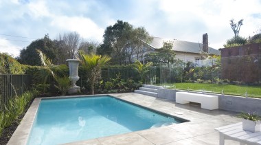 Exterior view of traditional pool area. Features small backyard, estate, home, house, leisure, property, real estate, residential area, swimming pool, villa, yard, white