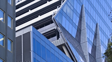 Exterior view of the contemporary Ark building - apartment, architecture, building, city, commercial building, condominium, corporate headquarters, daylighting, daytime, elevation, facade, headquarters, house, landmark, metropolis, metropolitan area, mixed use, residential area, sky, skyscraper, structure, tower block, urban area, window, blue, teal