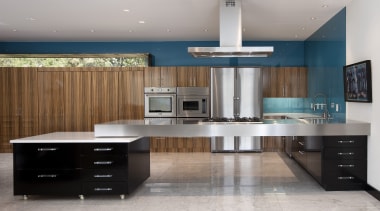 View of a minimalist kitchen which features floating cabinetry, countertop, cuisine classique, floor, interior design, kitchen, gray