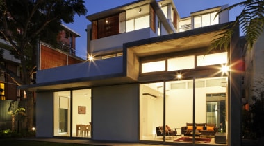 Exterior view of a three unit development designed architecture, building, elevation, facade, home, house, lighting, property, real estate, residential area, roof, window, black