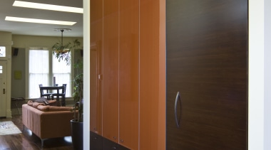 View of kitchen which features custom refrigerator cabinetry. cabinetry, ceiling, door, floor, flooring, hardwood, interior design, room, wall, wood, wood flooring, brown