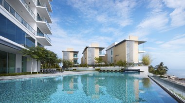 Exterior view of the Springtide Residence on Penang apartment, condominium, estate, home, hotel, leisure, property, real estate, resort, resort town, sky, swimming pool, vacation, villa, teal